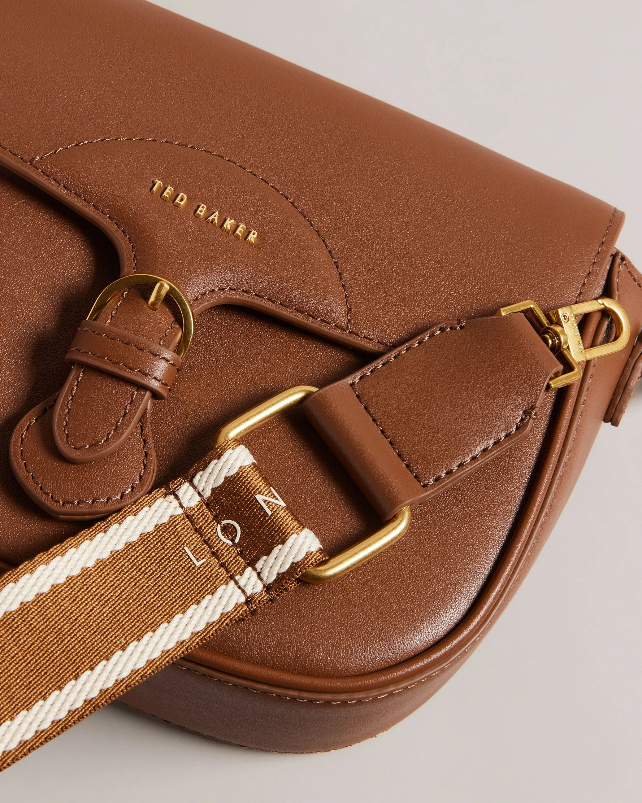Esia Webbing Crossbody Saddle Bag Brown